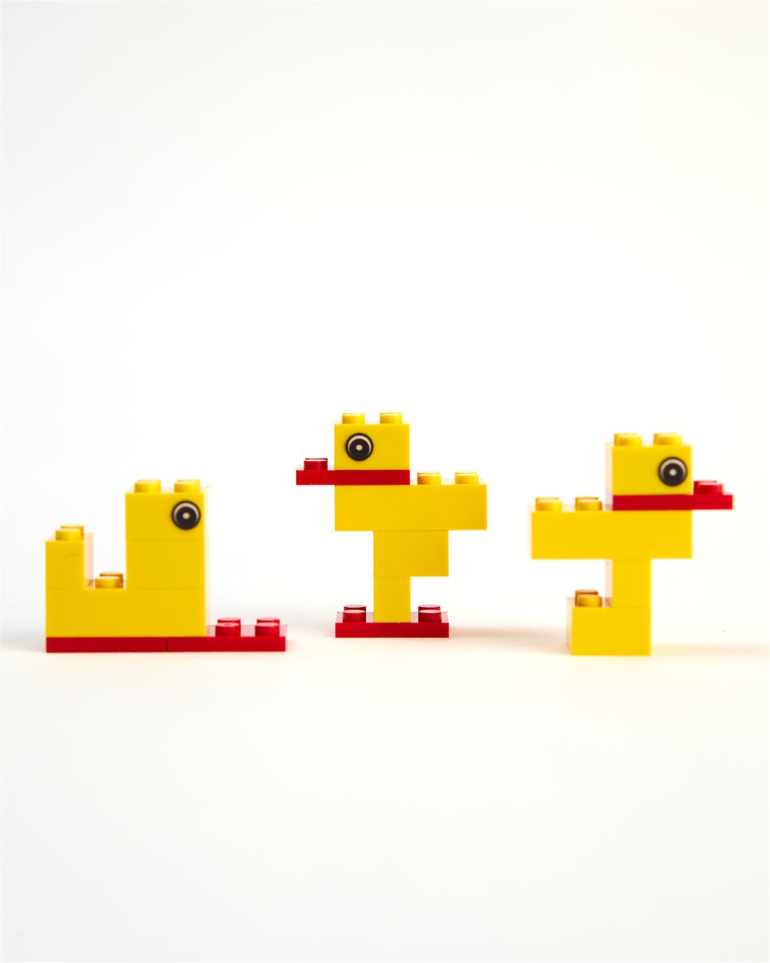 Three different ducks built from the same bricks